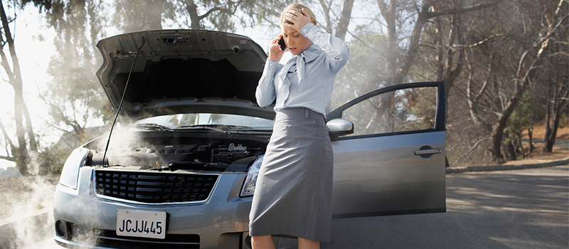 Business woman stranded with overheating car