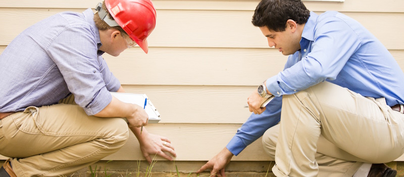 Home inspectors checking a foundation