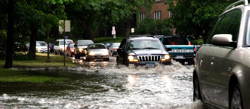 Cars driving through a flood