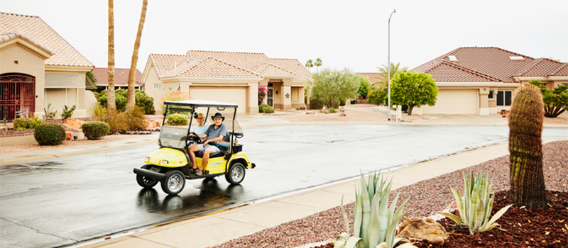 Couple riding in a golf cart