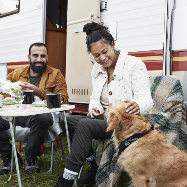 RV couple with dog